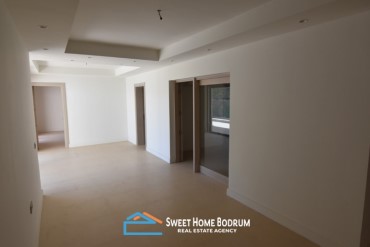 Gündoğan'da kendi plajı ve sosyal tesisi olan site içinde daire